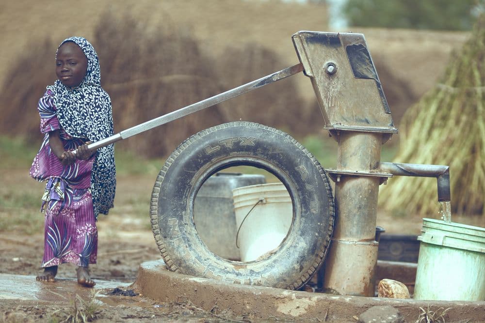 A child fetching water from a well