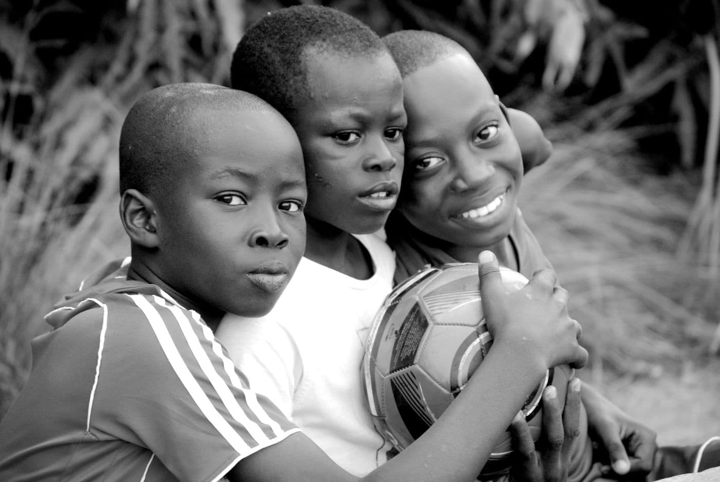 Children playing football together