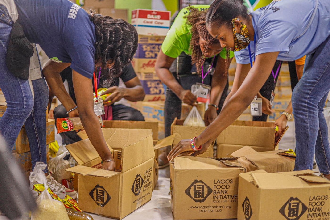 Volunteers organizing relief and food aid supplies for distribution
