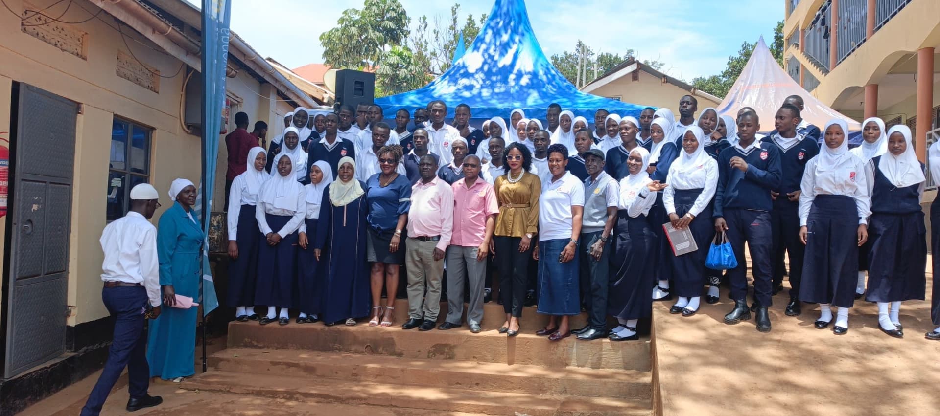 Students and staff gathered for a group photo at a school event
